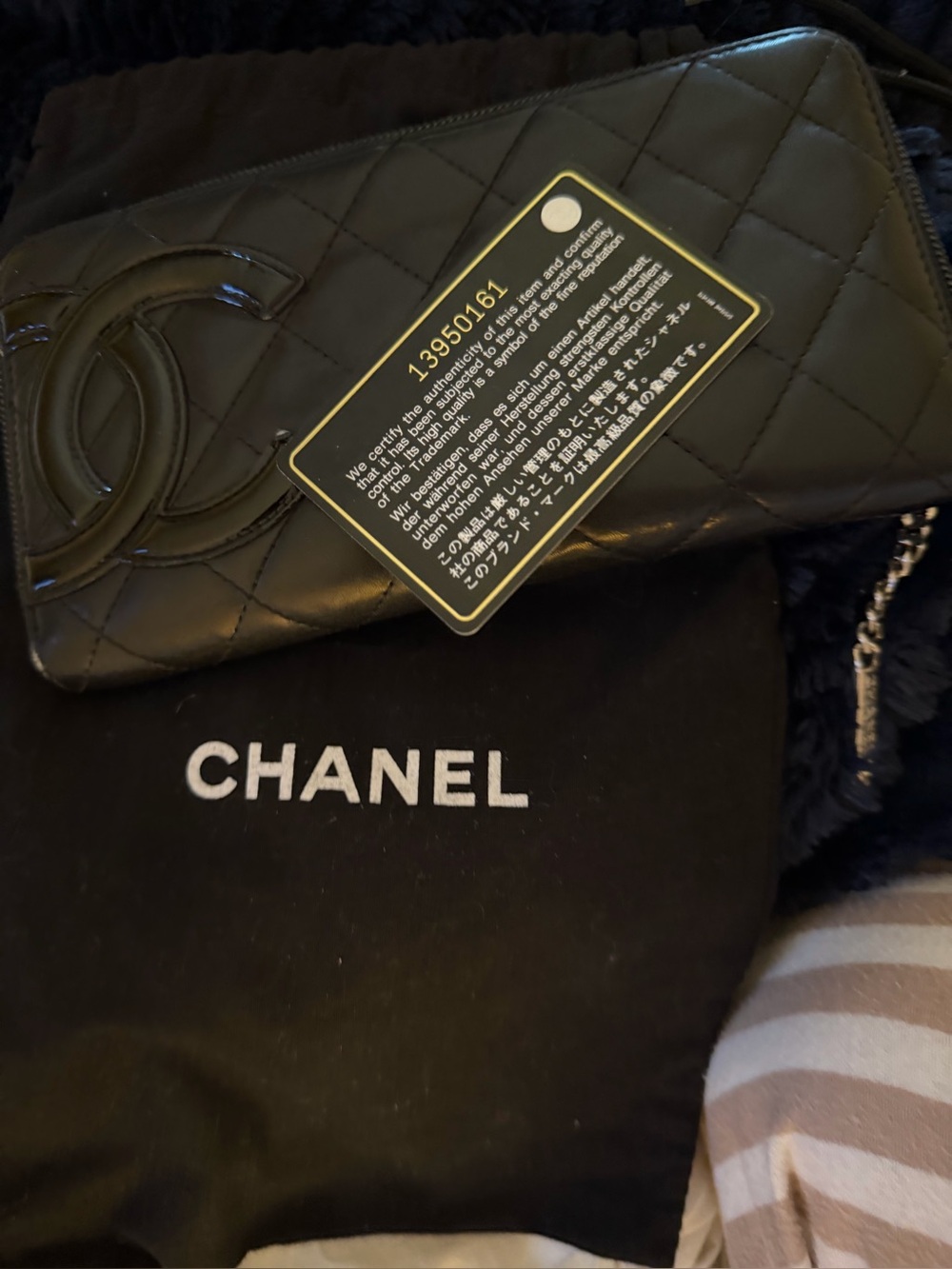 CHANEL Black Quilted Zip-Around Wallet with Patent CC Accent